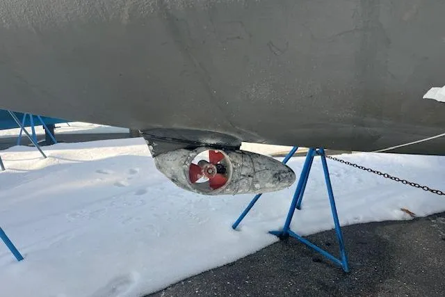 Slide: The Image of 1987 Irwin 43 Mk II Cruiser propeller on snowy ground with blue stands. - 17