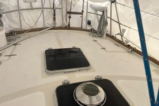 Slide: The Image of 1987 Irwin 43 Mk II Cruiser deck with hatches and rigging under cover. - 23