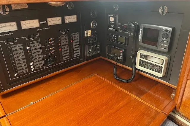 Slide: The Image of Control panel of 1987 Irwin 43 Mk II Cruiser with navigation and communication equipment. - 28