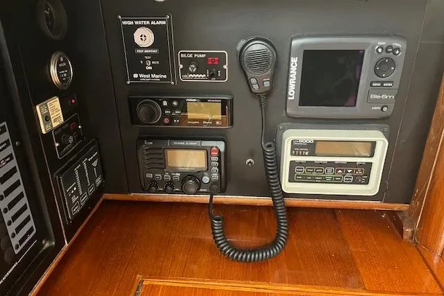 Slide: The Image of Control panel of a 1987 Irwin 43 Mk II Cruiser with navigation and communication equipment. - 30