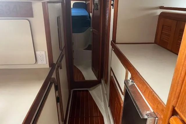 Slide: The Image of 1987 Irwin 43 Mk II Cruiser interior with wood accents and compact layout. - 32