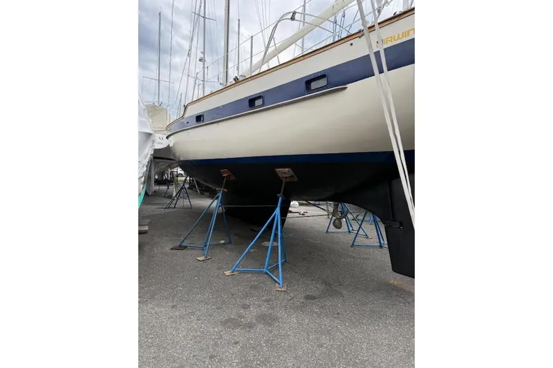 Slide: The Image of 1987 Irwin 43 Mk II Cruiser sailboat on stands, ready for maintenance. - 4