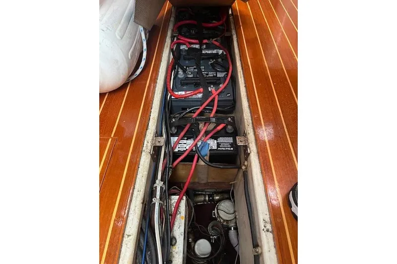 Slide: The Image of Battery compartment of 1987 Irwin 43 Mk II Cruiser with red cables and wooden flooring. - 40