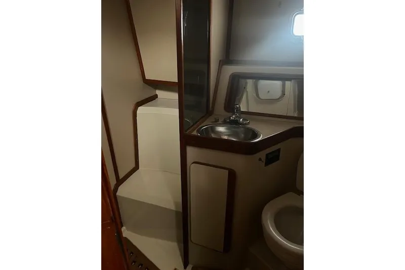 Slide: The Image of 1987 Irwin 43 Mk II Cruiser bathroom with sink, mirror, and toilet. - 45