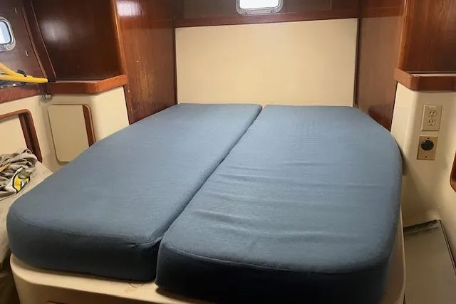 Slide: The Image of Interior cabin of 1987 Irwin 43 Mk II Cruiser with blue cushions. - 48