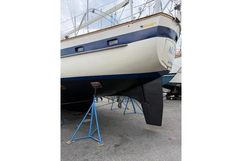 Slide: The Image of 1987 Irwin 43 Mk II Cruiser sailboat on stands, showcasing hull and keel design. - 5
