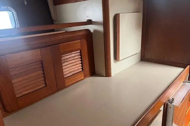 Slide: The Image of Interior of 1987 Irwin 43 Mk II Cruiser with wooden cabinetry and countertop. - 59