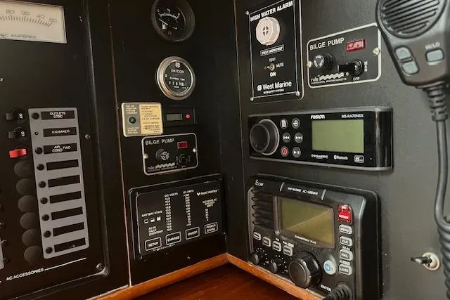 Slide: The Image of Control panel of a 1987 Irwin 43 Mk II Cruiser with navigation and communication equipment. - 60