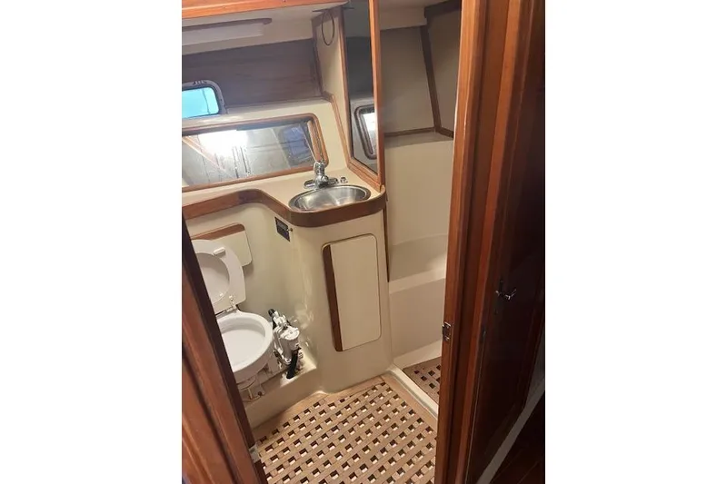 Slide: The Image of 1987 Irwin 43 Mk II Cruiser bathroom with wooden accents and compact design. - 62