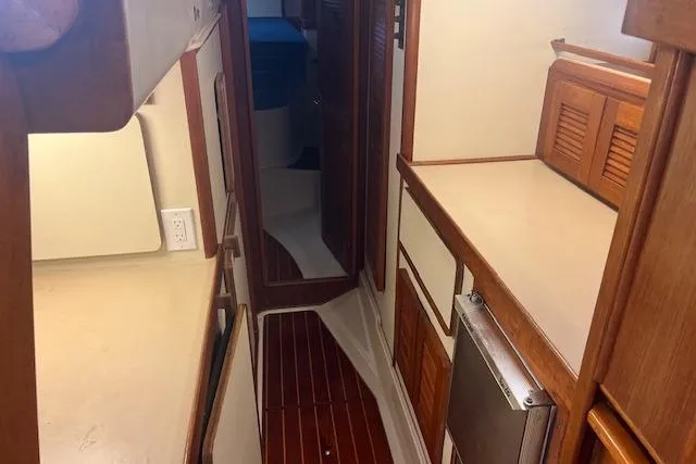 Slide: The Image of 1987 Irwin 43 Mk II Cruiser interior with wood finishes and compact layout. - 66