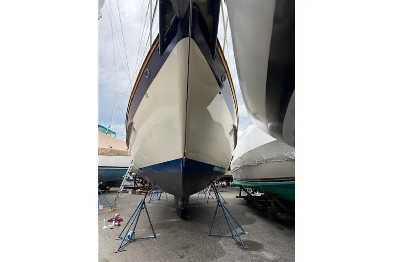 Slide: The Image of 1987 Irwin 43 Mk II Cruiser sailboat on stands, viewed from the front. - 7