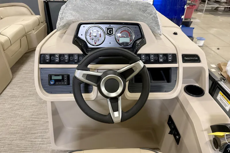 Slide: The Image of Steering console of 2026 Godfrey Sweetwater 2286 SFL boat with modern controls and gauges. - 5