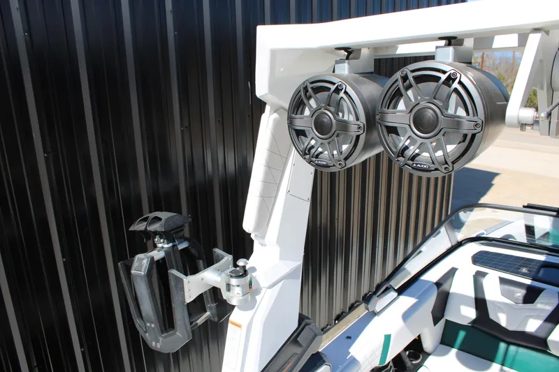 Slide: The Image of 2021 Nautique Super Air Nautique G21 boat speakers and wakeboard rack detail. - 14