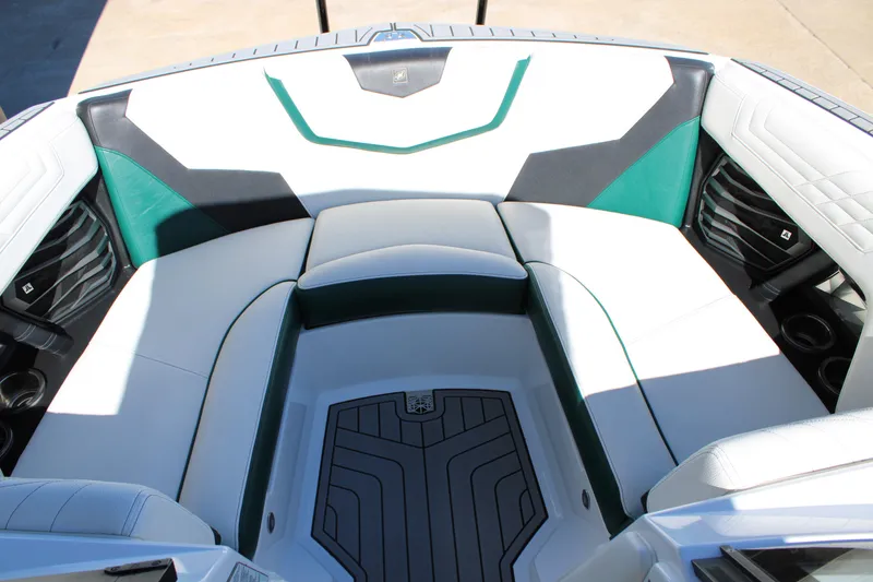 Slide: The Image of 2021 Nautique Super Air Nautique G21 boat interior with white and green seating. - 16