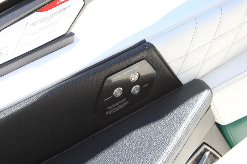 Slide: The Image of 2021 Nautique Super Air Nautique G21 interior control panel with leather detailing. - 19