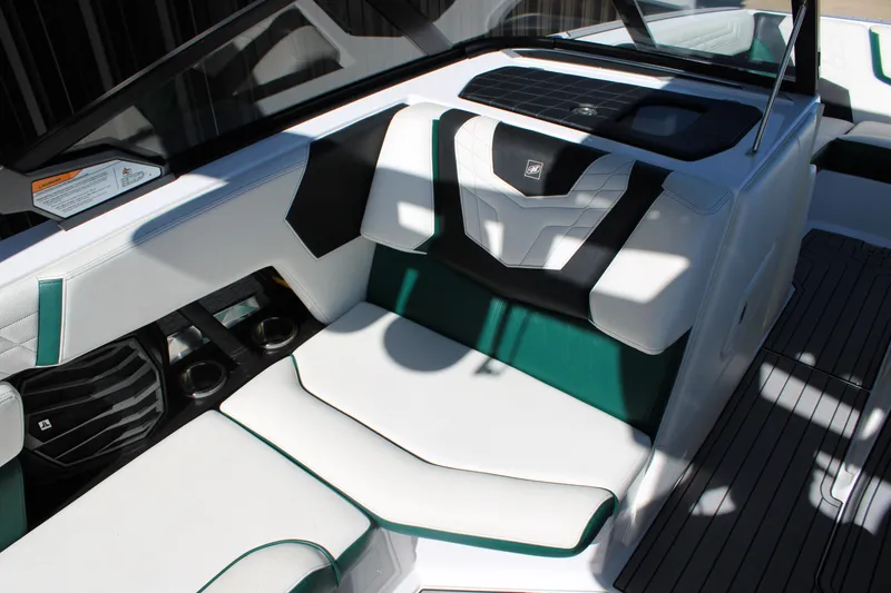 Slide: The Image of 2021 Nautique Super Air Nautique G21 interior with white and green seating. - 20