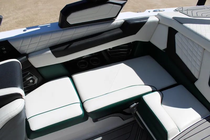 Slide: The Image of 2021 Nautique Super Air Nautique G21 interior seating with white and black upholstery. - 22