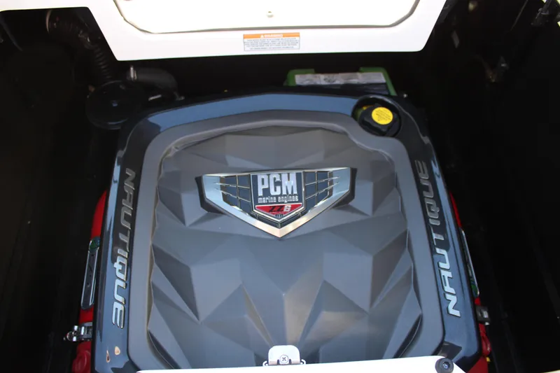 Slide: The Image of 2021 Nautique Super Air Nautique G21 engine compartment with PCM marine engine. - 23