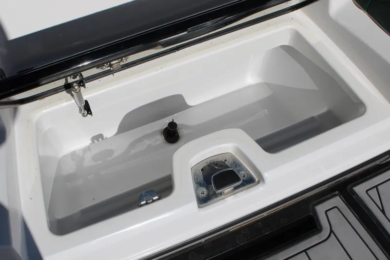 Slide: The Image of 2021 Nautique Super Air Nautique G21 storage compartment, open and empty. - 25