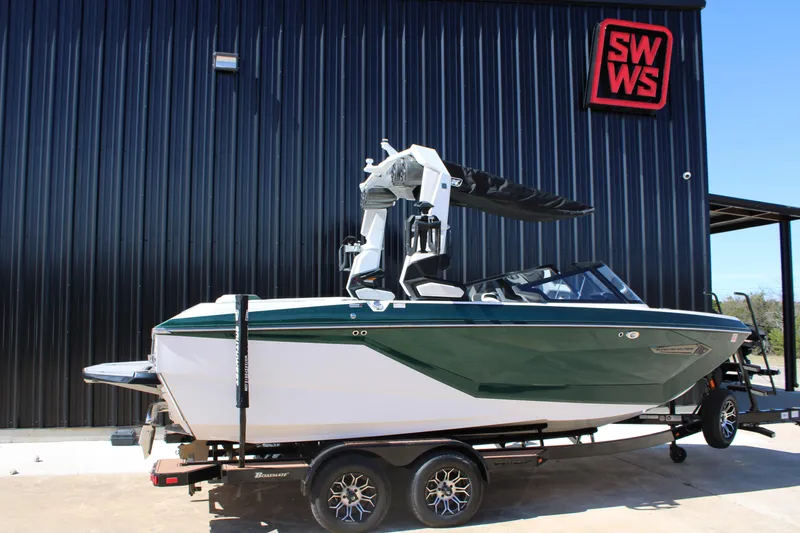 Slide: The Image of 2021 Nautique Super Air Nautique G21 boat on trailer, parked outside SWWS building. - 5