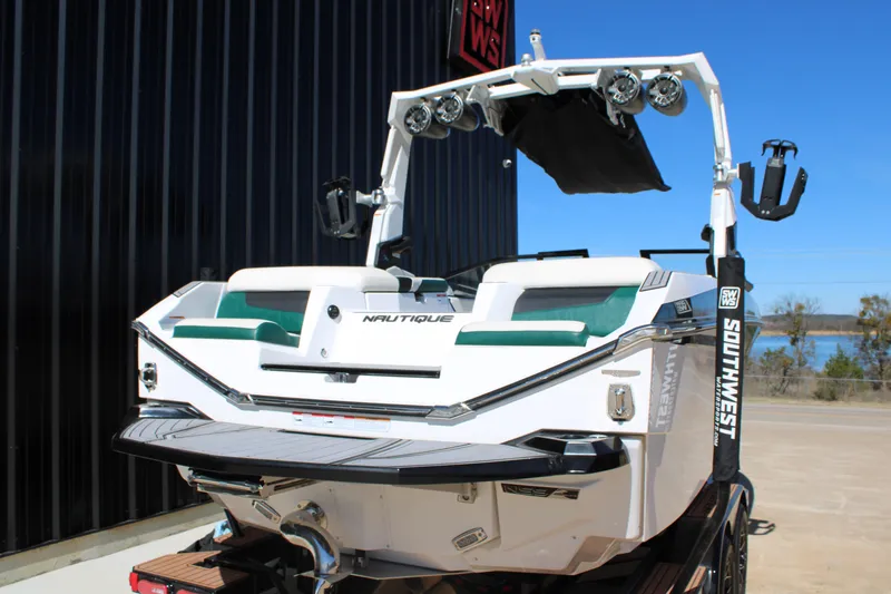 Slide: The Image of 2021 Nautique Super Air Nautique G21 boat, rear view with speakers and seating. - 7