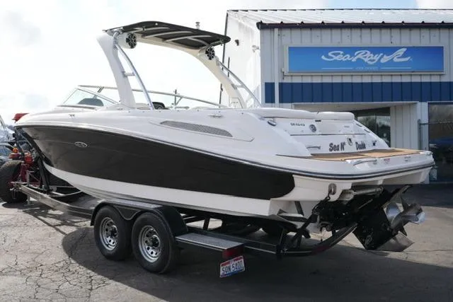 Slide: The Image of 2008 Sea Ray SLX 250 boat on trailer, parked outside dealership. - 7