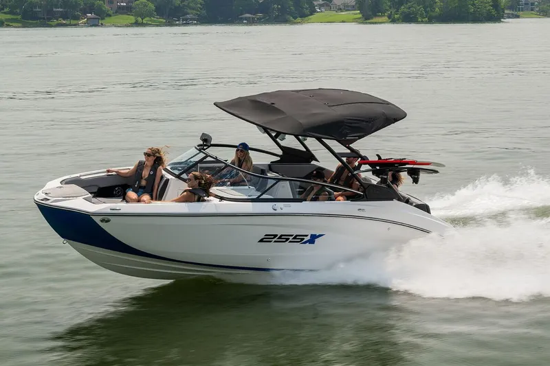 Slide: The Image of Manufacturer Provided Image: 2026 Yamaha Boats 255XE cruising on a lake with passengers enjoying the ride. - 11