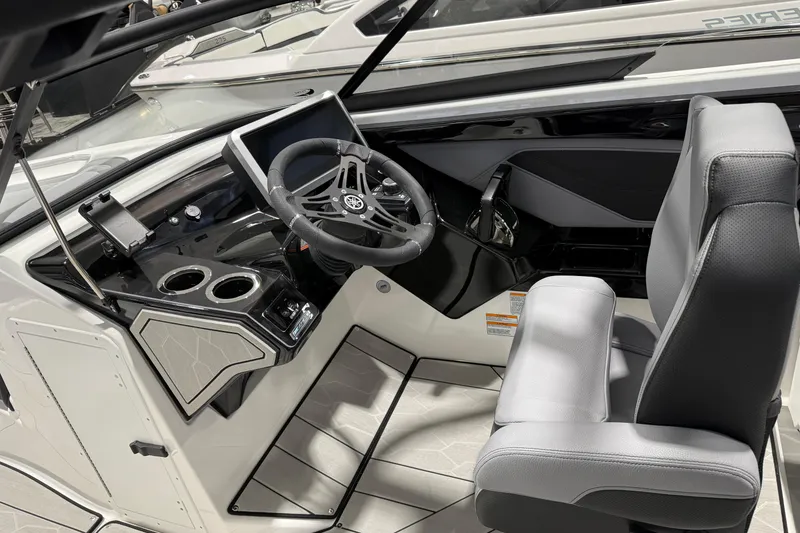 Slide: The Image of 2026 Yamaha Boats 255XE cockpit with modern steering and controls. - 5