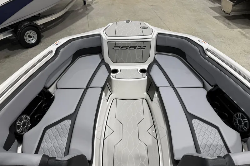 Slide: The Image of 2026 Yamaha Boats 255XE interior with sleek gray seating and modern design. - 8
