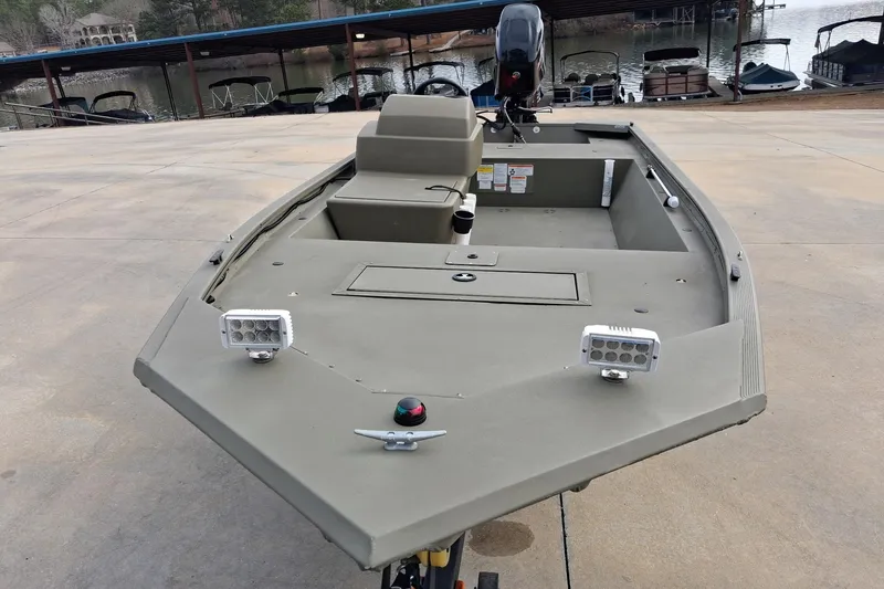 Slide: The Image of 2023 G3 Gator Tough 18 CC boat at dockside, featuring dual LED lights. - 3