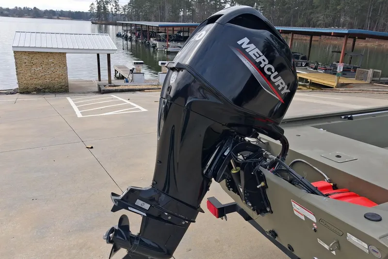 Slide: The Image of 2023 G3 Gator Tough 18 CC boat with Mercury outboard motor at a lakeside dock. - 8