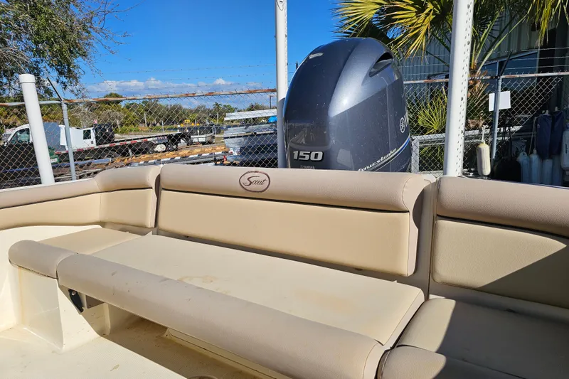 Slide: The Image of 2016 Scout 210 XSF boat interior with Yamaha 150 engine, beige seating. - 16