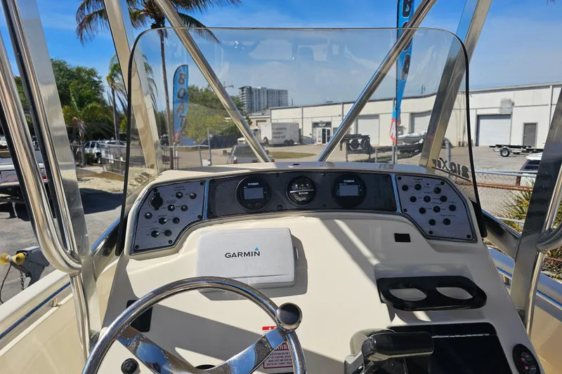 Slide: The Image of 2016 Scout 210 XSF boat dashboard with Garmin navigation system and control panel. - 30