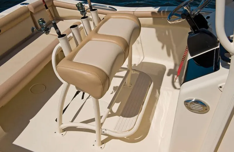 Slide: The Image of Manufacturer Provided Image: 2016 Scout 210 XSF boat interior with cushioned seating and rod holders. - 7
