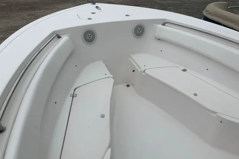 Slide: The Image of 2015 Tidewater 220 CC Adventure boat interior with seating and speakers. - 9