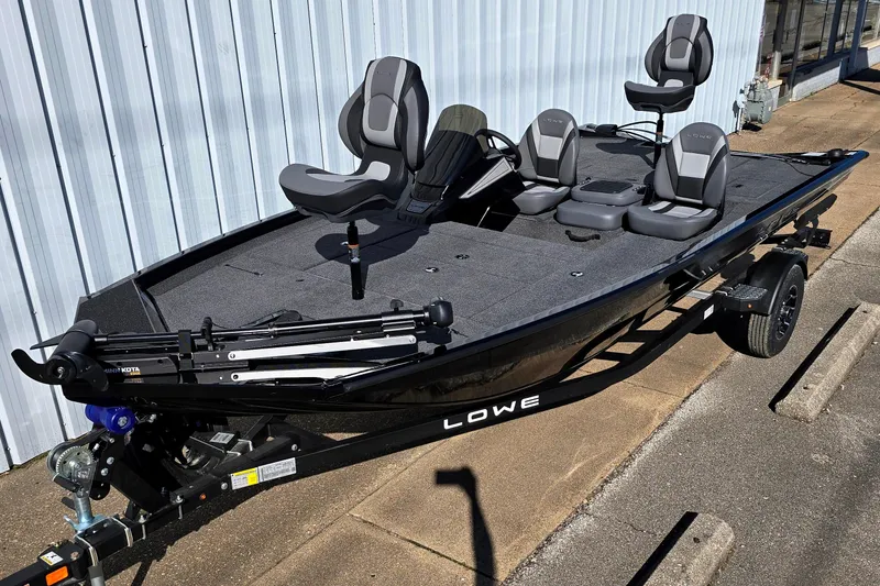 The Image of 2026 Lowe Stinger 175 fishing boat with seating, on a trailer, parked outdoors. - 0