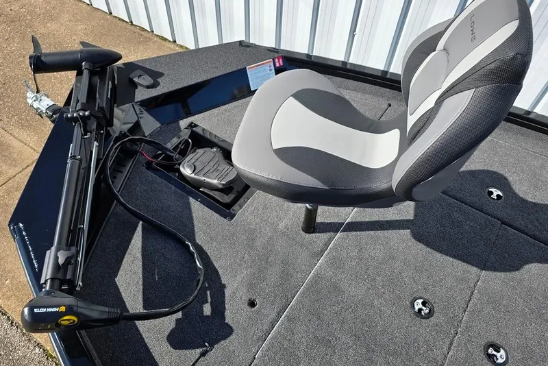 Slide: The Image of 2026 Lowe Stinger 175 boat interior with swivel seat and trolling motor. - 4
