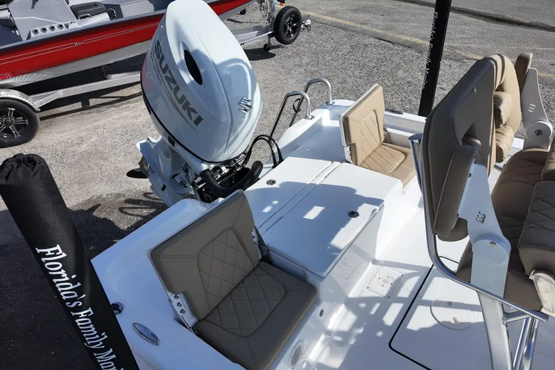 Slide: The Image of 2026 Blazer PureBay 2200 boat with Suzuki engine, featuring beige seating and sleek design. - 10