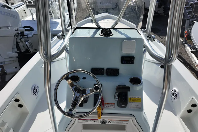 Slide: The Image of 2026 Blazer PureBay 2200 boat console with steering wheel and controls. - 5