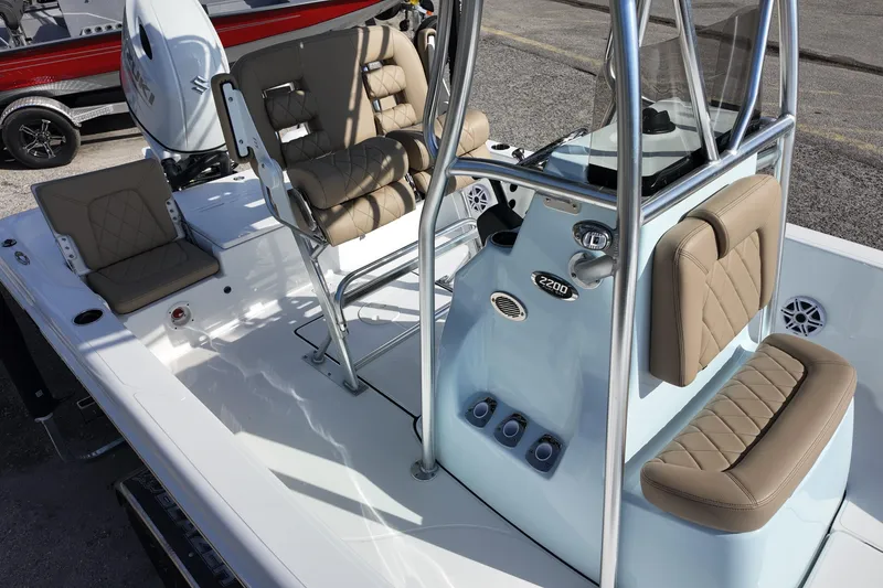 Slide: The Image of 2026 Blazer PureBay 2200 boat interior with tan seating and modern console design. - 9