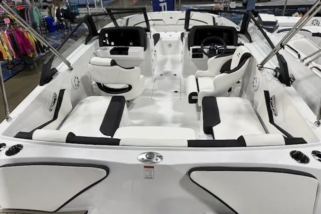 Slide: The Image of 2026 Stingray 20 SBX boat interior with white and black seating, showcasing modern design. - 2
