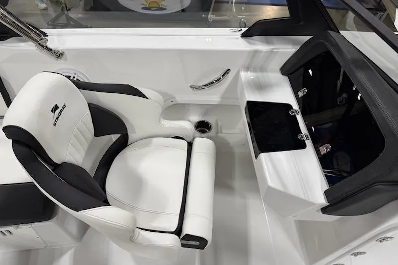 Slide: The Image of 2026 Stingray 20 SBX boat interior with white and black seating and console. - 4