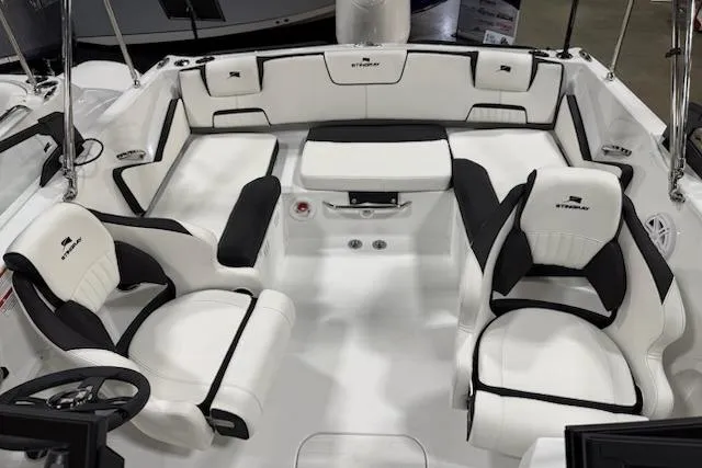 Slide: The Image of 2026 Stingray 20 SBX boat interior with white and black seating, modern design. - 5