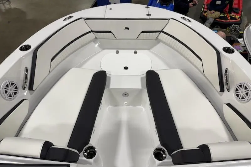 Slide: The Image of 2026 Stingray 20 SBX boat interior with sleek white and black seating arrangement. - 6