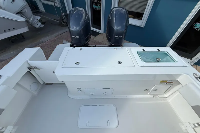 Slide: The Image of 2023 Parker 2520 XLD Sport Cabin boat with dual 200 horsepower engines, rear deck view. - 12