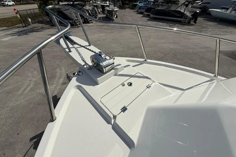 Slide: The Image of 2023 Parker 2520 XLD Sport Cabin boat deck with anchor and railing. - 19