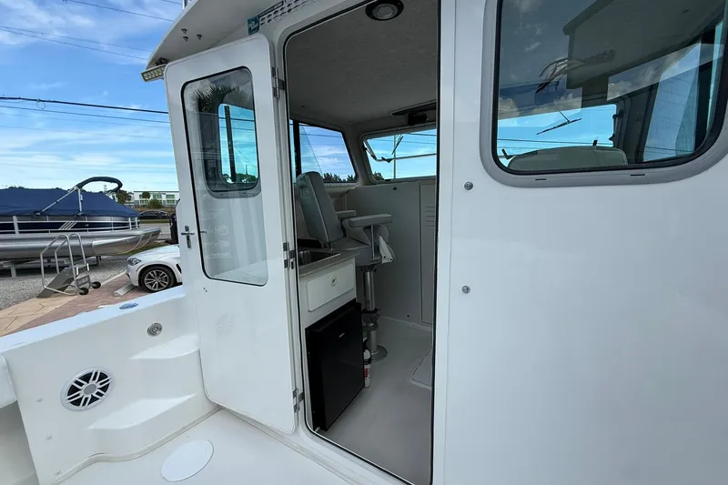 Slide: The Image of 2023 Parker 2520 XLD Sport Cabin interior view with open door and seating. - 22