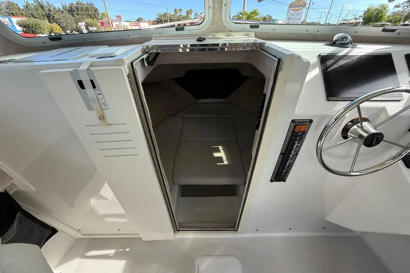 Slide: The Image of 2023 Parker 2520 XLD Sport Cabin interior with steering wheel and cabin entrance. - 28