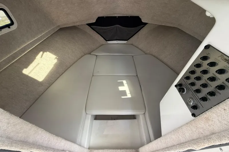 Slide: The Image of 2023 Parker 2520 XLD Sport Cabin interior with control panel and cushioned seating. - 29