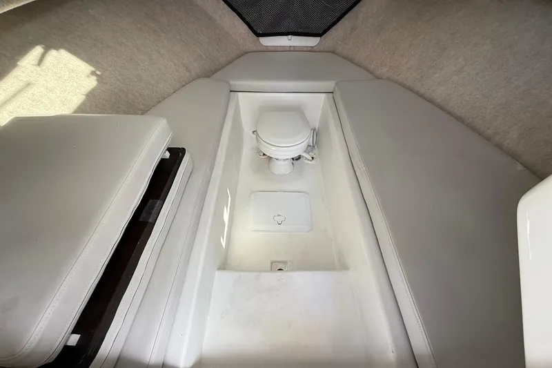 Slide: The Image of 2023 Parker 2520 XLD Sport Cabin interior with toilet and cushioned seating. - 30